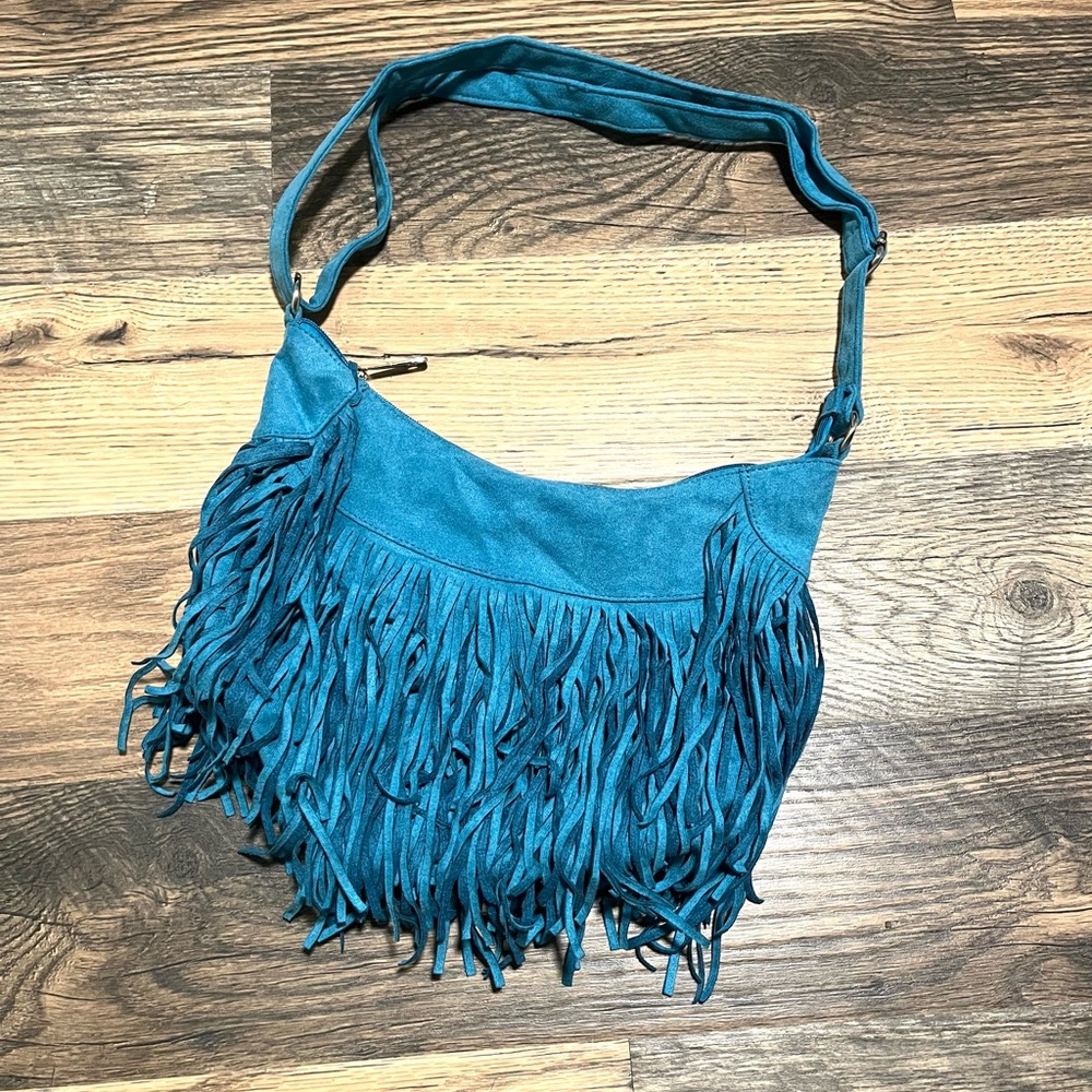Brand new turquoise faux suede fringe purse